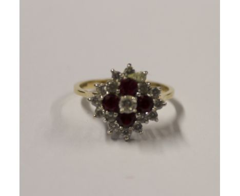 A 9ct yellow gold ladies' dress ring, floral-set with red topaz and cubic zirconia, size Q, approx 4.1g.