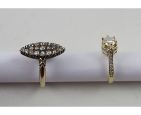 An 18ct yellow gold ladies' dress ring, marquise setting with nineteen small diamonds (lacking one stone, originally 20), siz