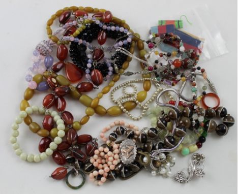 A quantity of vintage and contemporary costume jewellery to include necklaces, bracelets, brooches etc.