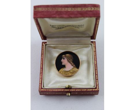 An 18ct yellow gold and enamel brooch.