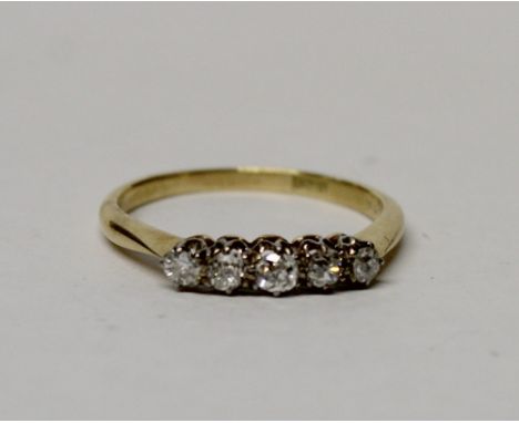 An 18ct yellow gold dress ring set with five small diamonds, size N1/2, approx 2.3g.