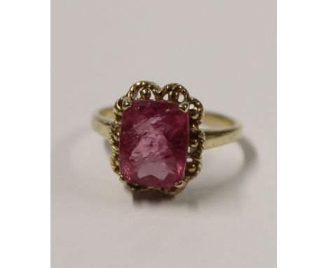 A 9ct yellow gold ladies' dress ring with rectangular facet-cut pink tourmaline, size M, approx 2.5g.