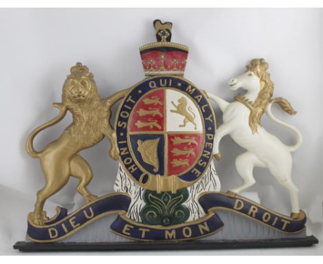 A vintage wooden carved and painted Royal coat of arms, approx 69.5 x 93cm.