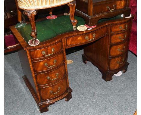 A Reproduction Leather Inset Kneehole Desk, 115cm by 53cm by 74cmLeather with heavy wear and scratches, body with a few light