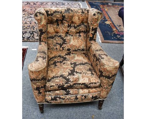 A Regency Style Mahogany Framed Button Back Wing Chair, feather filled and moving on castors
