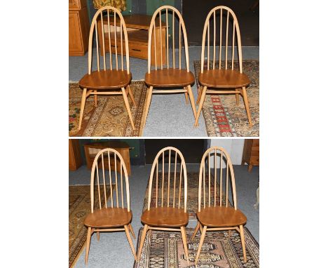 A Set of Six Light Elm Ercol Stick Back Dining ChairsA little faded to the hoop back, with the usual scuffs to the legs, stru