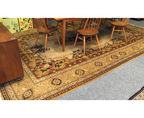 A Gol Farang Carpet, the light camel field with central floral medallion enclosed by mustard borders of acanthus vines, 430cm