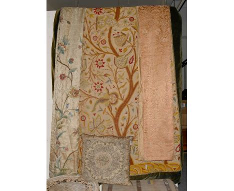 A Pair of Early 20th Century Crewel Work Embroidered Curtains depicting the tree of life worked on a dark cream woven ground,