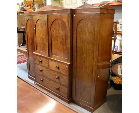 A 19th Century Mahogany Breakfront Wardrobe, of small proportions, with two central doors opening to reveal dressing slides, 