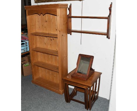 A Small Group of Furniture Includng: a pine open bookcase, 84cm by 25cm by 165cm, a 1960s teak nest of three table, a two tie