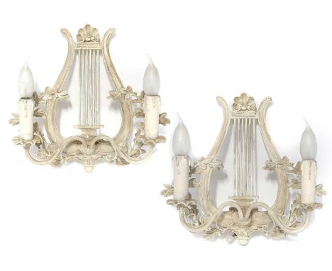 A Set of Three Painted Lyre Twin Light Wall Sconces, each 32cm, (one damaged)Composite One with losses, the other two appear 