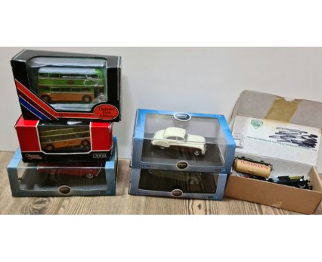 3 cased Oxford Automobile model cars, 3 Bachmann 0 gauge railway tanker wagons, and 2 die cast double deck bus models 