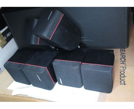 An Acoustimas-7 Bose home theatre speaker system and a bag of relating cables 