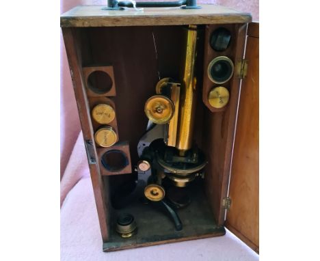 A vintage brass microscope in wooden case, by Swift &amp; Sons, Tottenham Rd, London. 