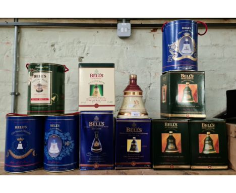 A collection of 11 Bell's ceramic whiskey decanters, all sealed, 10 boxed. 
