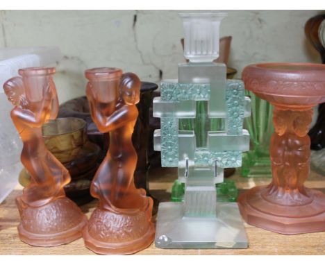 A group of pressed glass including a pair of figural candle sticks and a centre piece attributed to Bagley, smoked glass, a L