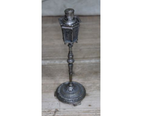 A plated lighter in shape of a street lantern. 