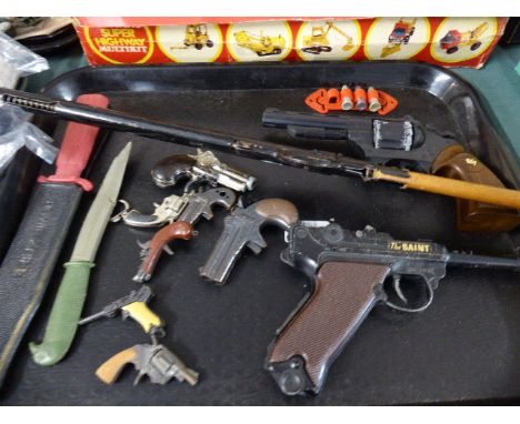 A Collection of Vintage Toy Guns and Knives to include The Saint's Luger and a 1960's Pop Gun