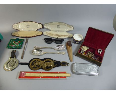 A Box of Curios to Include Costume Jewellery, Horse Brasses, Serving Spoons, Royal Worcester Candle Etc 