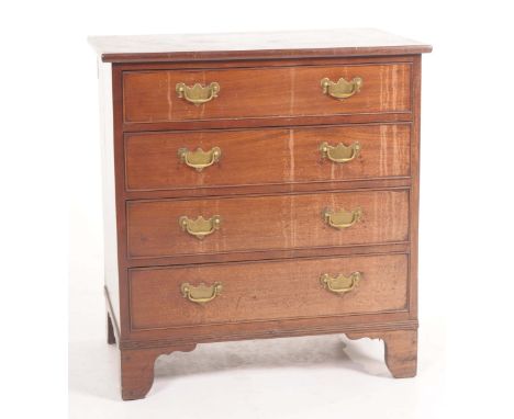 A George III mahogany bachelors chest The rectangular top above four cockbeaded drawers with brass back plates and swing hand