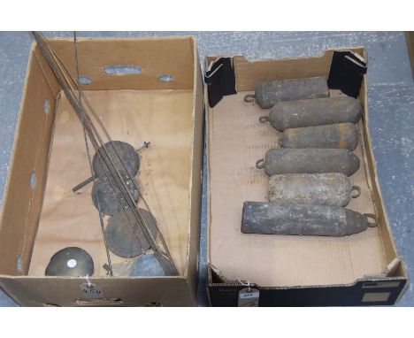 Six assorted longcase clock weights and assorted pendulum partsThe longest weight approximately 30cm.