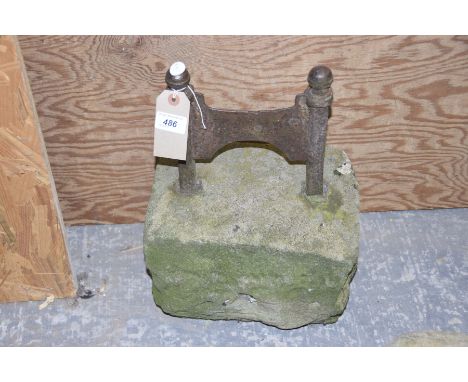 A Victorian cast iron boot scraperOf typical form with spherical finials, the H shaped bracket mounted in a substantial sands