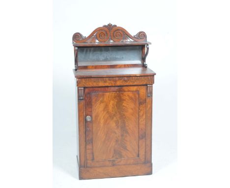 An early 19th Century mahogany chiffonier of small proportions With a scrolling twin neck pediment above a single shelf suppo