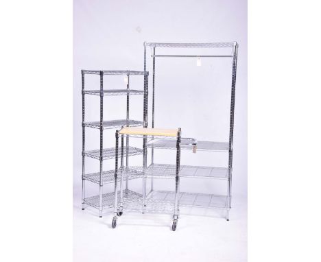 A contemporary chrome metal freestanding adjustable set of shelves, along with a conforming clothes storage unit and kitchen 