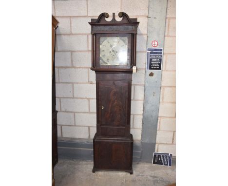 A late 18th/19th Century mahogany cased longcase clockWith a twin swan neck pediment above tapering columns flanking a 14 inc