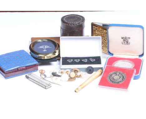 A collection of miscellaneous itemsTo include, a proof coin, a collection of Gents studs, a mother of pearl tool, a compact, 