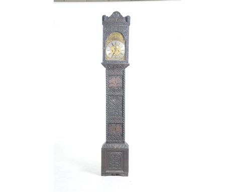 A 17th/18th Century carved oak longcase clock, Tho. Townson, PinningtonThe arched carved hood applied with two human masks ab