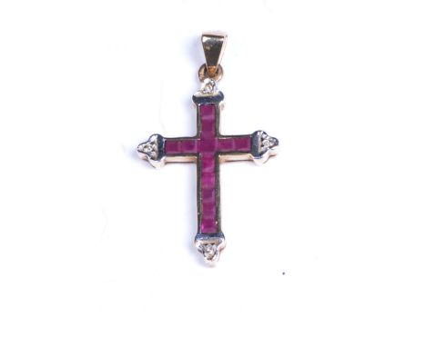 A ruby and diamond pendantIn cross form, to 9ct gold, weight approx. 1.6g