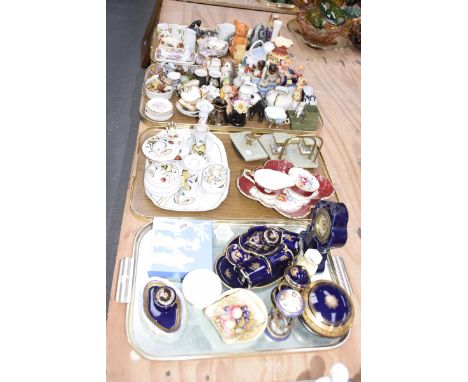 A large collection of ceramic ornamentsTo include pig condiments, owl condiments, bear money box, napkin rings, Beswick birds