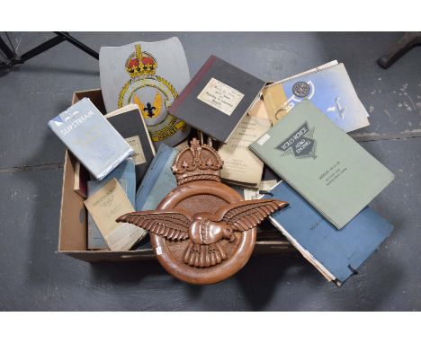 A large collection of RAF related EphemeraTo include a carved hardwood RAF badge in the form of a bird surmounted by a crown,