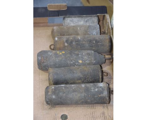 Six assorted longcase clock weightsThe longest 24cm.