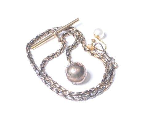 A Masonic silver and gold plated puzzle ballTo a gold plated chain and T-bar