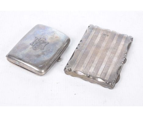 Two silver cigarette casesThe first, of plain rectangular form, monogrammed, Birmingham 1904, the second, of rectangular form