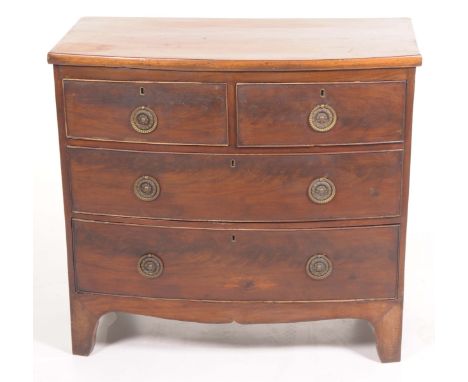 An early 19th Century mahogany bowfront chest of drawersWith two short over two long cockbeaded drawers, brass ring swing han