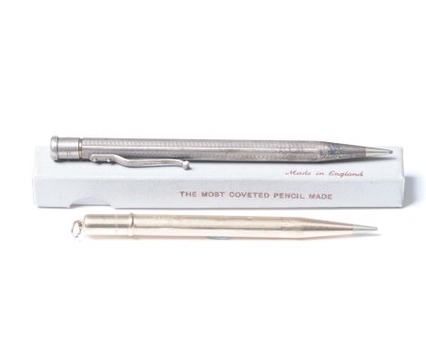 A 9ct gold pencilWith engine turned decoration, loaded, together with, a silver plated pencil (2)