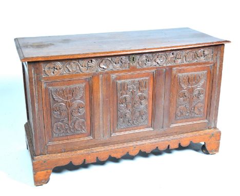 An 18th Century and later carved oak blanket chestThe rectangular moulded top enclosing a fitted candle box above a frieze pr