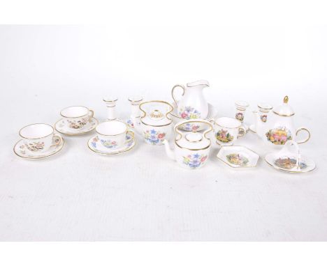 A Spode dolls tea service, late 20th CenturyComprising kettle, two teacups and saucers, hot water jug, two pairs of candlesti