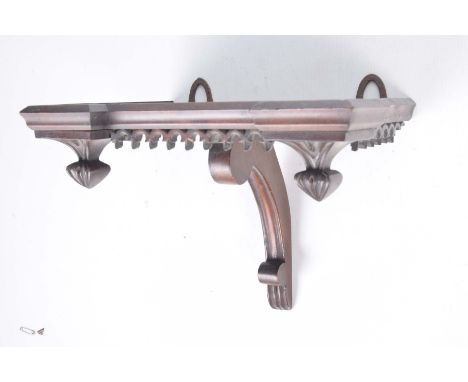 A mahogany wall bracket in the Gothic style, late 19th CenturyBracket 23cm deep, 32cm wide, 21cm high with carved fretwork de