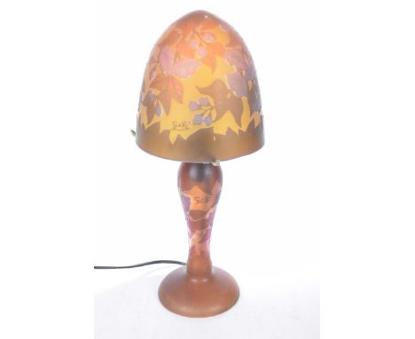 A glass overlay table lamp, 20th CenturyThe glass shade decorated with flowers marked Galle, with matching base, height 41cm,