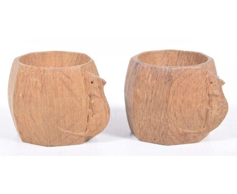 A pair of Robert Thompson (Mouseman) napkin rings, mid to late 20th Century,The octagonal shaped rings each with carved trade