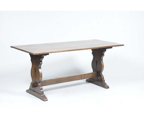 A good quality 17th Century style oak refectory table, mid 20th CenturyThe rectangular top supported on two shaped bracket su