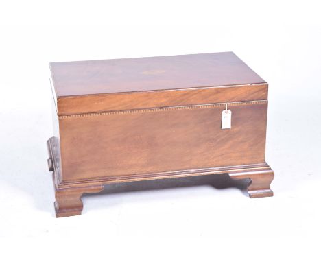 An Edwardian style mahogany blanket or storage chestThe rectangular hinged top centred with an oval fan, raised on ogee brack