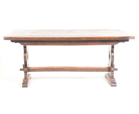 A good quality 18th Century style oak refectory table, 20th CenturyThe substantial slab top supported on two shaped bracket s