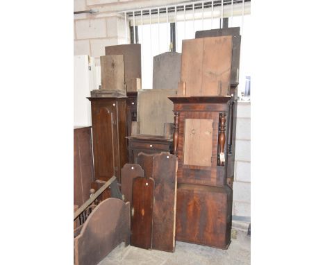 Six assorted longcase clock casesTo include George III oak and mahogany crossbanded, early 19th Century mahogany case with tu