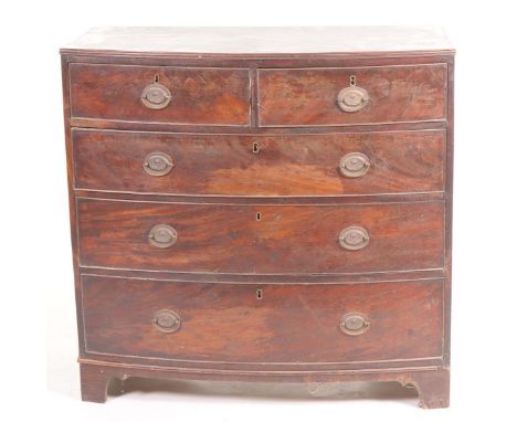 An early 19th Century bowfront mahogany chest of drawersWith two short and three long cockbeaded drawers, oval brass back pla