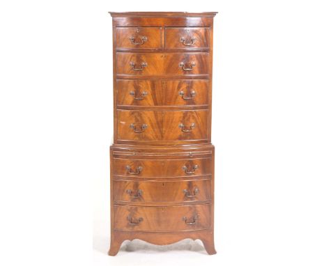 An impressive George III style mahogany bowfront chest on chestThe upper chest with a moulded top above two short and three l